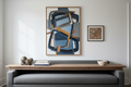 A finished room wall with art hung beautifully — large abstract canvas above sofa, smaller framed work to the right, console with sculpture below